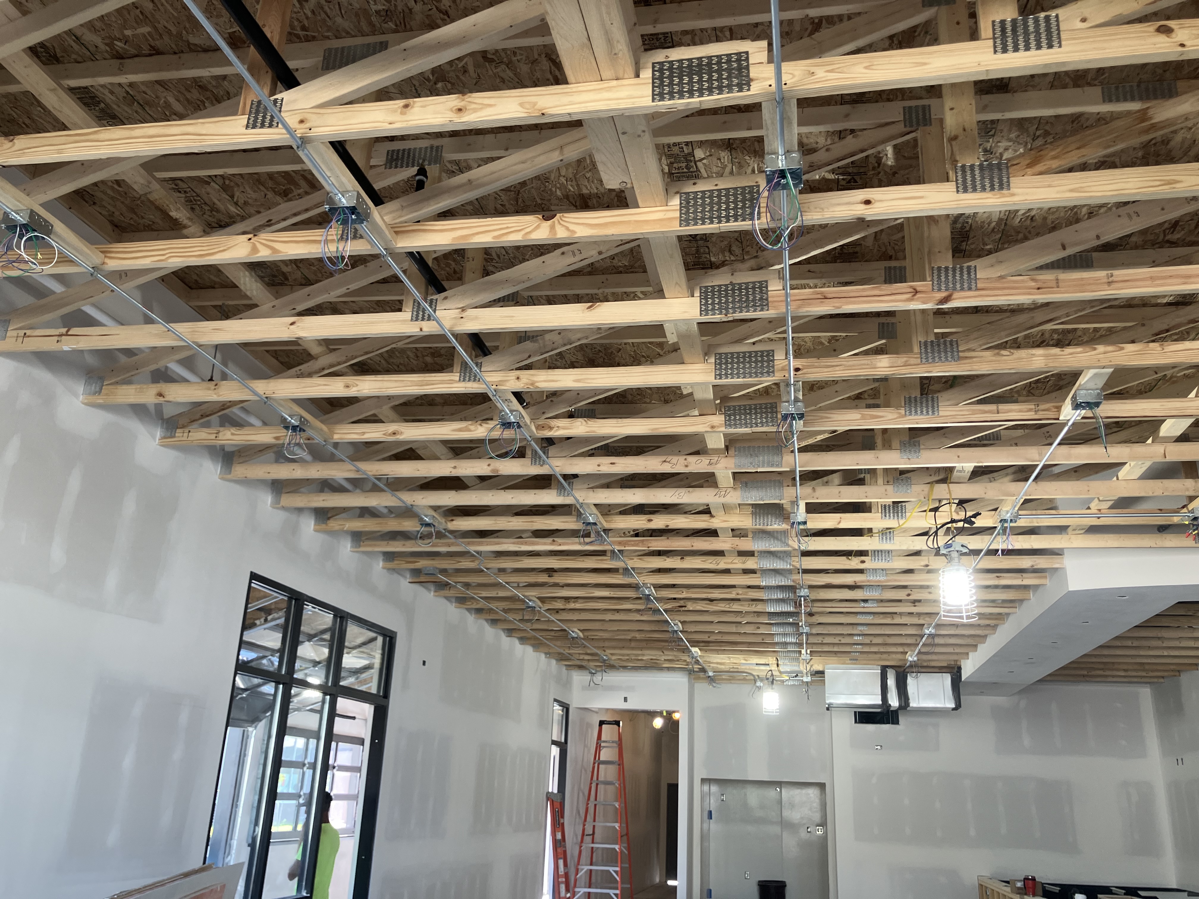 Commercial flat black open ceiling painted by Spray GenX
